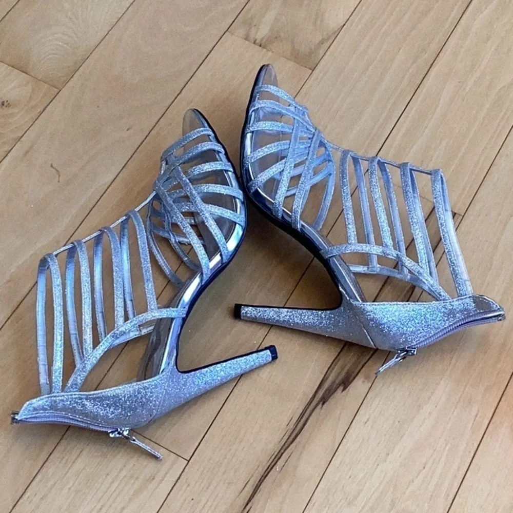 Nina silver glittery, strappy high heels, zipper to back. Women’s size 7